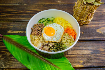 Korean food bibimbap with vegetables and fried egg
