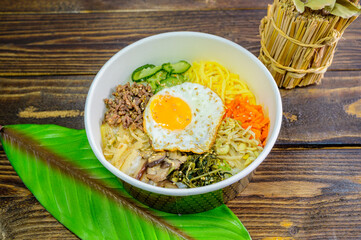 Korean food bibimbap with vegetables and fried egg