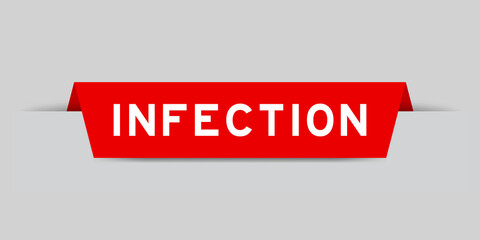 Red color inserted label with word infection on gray background