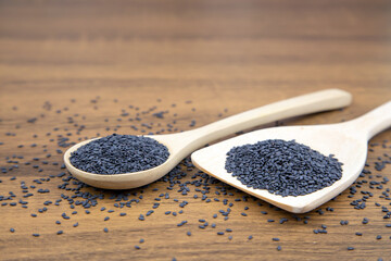 Sesame, Close-up black sesame seeds in a wooden spoon for healthy food and diet concepts.