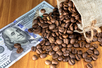 US dollars cash money and roasted coffee beans in Brazil