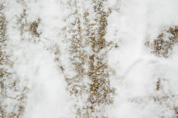 Obraz na płótnie Canvas Snow covered stone surface for a Christmas backdrop. White snow, gray rock.