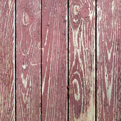 Wooden planks, painted with burgundy paint. Vintage cracked fence for card blank design, wallpaper.