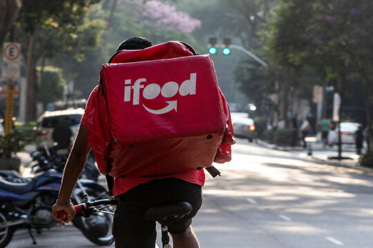 Sao Paulo, Brazil, June 18, 2021. Worker Ifood On The Bicycle Delivers Food To Customers In Higienopolis Neighborhood, Sao Paulo City.