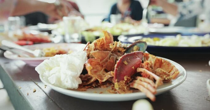 Dirty waste food and used napkin on plate after eating