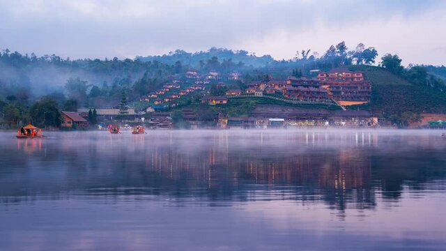 Time lapse of Tourists take a boat at Ban Rak Thai village in Mae Hong Son province, Thailand.