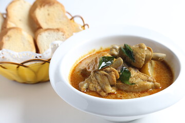 peranakan nonya spicy curry chicken cutlet and potato in white bowl with french toast bread in basket asian halal menu