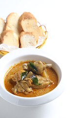 peranakan nonya spicy curry chicken cutlet and potato in white bowl with french toast bread in basket asian halal menu