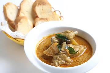 peranakan nonya spicy curry chicken cutlet and potato in white bowl with french toast bread in basket asian halal menu