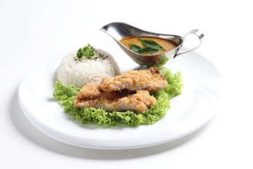 crispy deep fried chicken chop fish cutlet serve with nyonya spicy curry sauce and steam fragrant white jasmine rice and lettuce