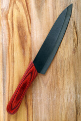Knife on cutting board on white background