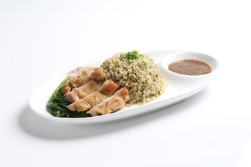 wok garlic olive fried rice with grilled chicken chop cutlet in brown sauce and vegetables on white...