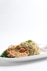 wok garlic olive fried rice with grilled chicken chop cutlet in brown sauce and vegetables on white plate asian halal menu