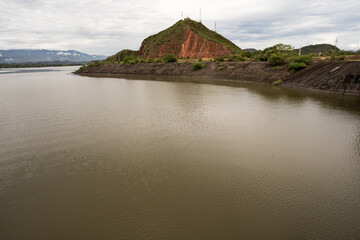Dam in the middle of the mountains in a cloudy day