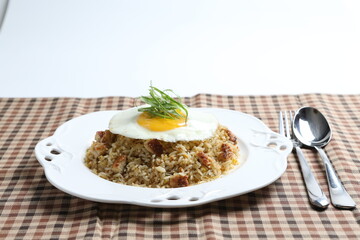 Japanese unagi fish wok garlic fried rice with fried egg and vegetables on white plate asian halal seafood menu