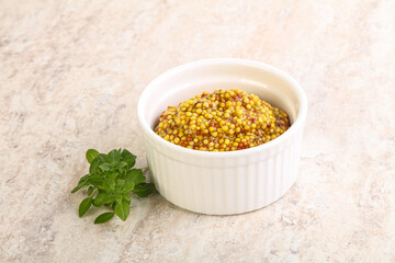 Grain mustard sauce in the bowl