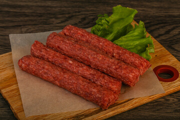 Raw beef sausages with spices