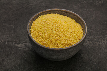 Raw cous cous heap in the bowl