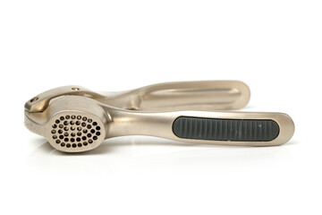 Garlic press on white background
