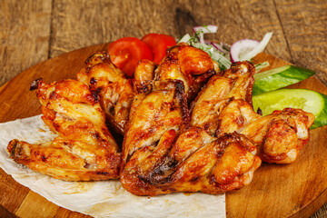 Chicken wings barbeque vith vegetables