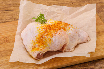 Raw chicken thigh with spices