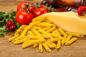 Raw penne rigate for cooking
