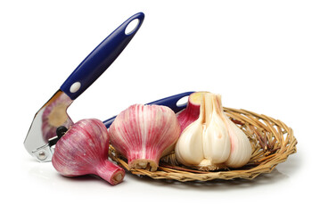 Garlic press and garlic on white background 