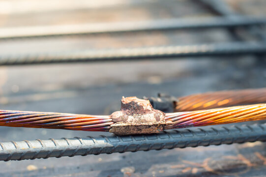 Welding copper ground wire on ground rod.Welding copper ground wire.Connect copper grounding lightning protection system. With the melting