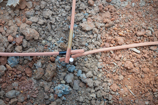 Welding copper ground wire on ground rod.Welding copper ground wire.Connect copper grounding lightning protection system. With the melting
