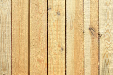 edged boards are laid in rows to dry. background from sawn boards. slots for air passage and blowing of wood.