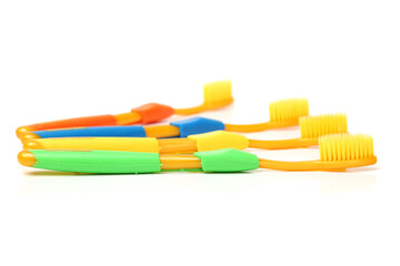 colorful toothbrushes on white background