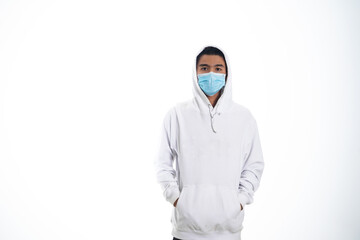 health, pandemic and safety concept - asian young man wearing face protective medical mask for protection from virus disease over white background