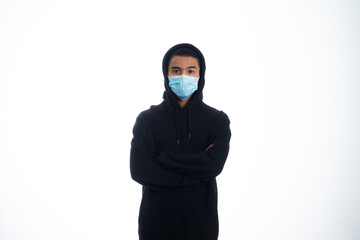 health, pandemic and safety concept - asian young man wearing face protective medical mask for protection from virus disease over white background