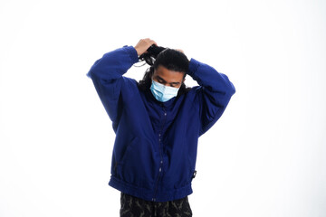 health, pandemic and safety concept - asian young man wearing face protective medical mask for protection from virus disease over white background