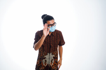 health, pandemic and safety concept - asian young man wearing face protective medical mask for protection from virus disease over white background