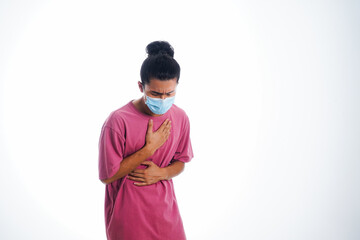 Covid19, the concept of health care and medicine. A young man standing in a face mask with hand gesture "i'm sick", supporting social distance