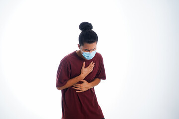 Covid19, the concept of health care and medicine. A young man standing in a face mask with hand gesture "i'm sick", supporting social distance