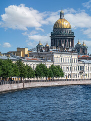 Fototapeta na wymiar Saint Petersburg, Moika river, the dome of St. Isaac's Cathedral, summer day. Russia, Saint Petersburg June 2021
