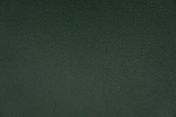 The shadow of the old cement  green  wall surface with cracks , texture , backgrounds for design