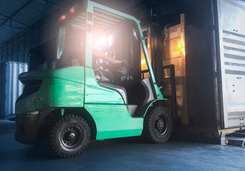 Forklift Tractor Loading Package Boxes into Cargo Container. Truck Parked Loading at Dock...