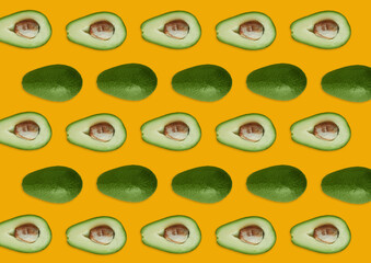 Organic avocado with seeds, avocado halves and whole fruit on a yellow background. Top view. Pop art design, creative concept of summer food. Avocado pattern on yellow background. Top view. Banner.