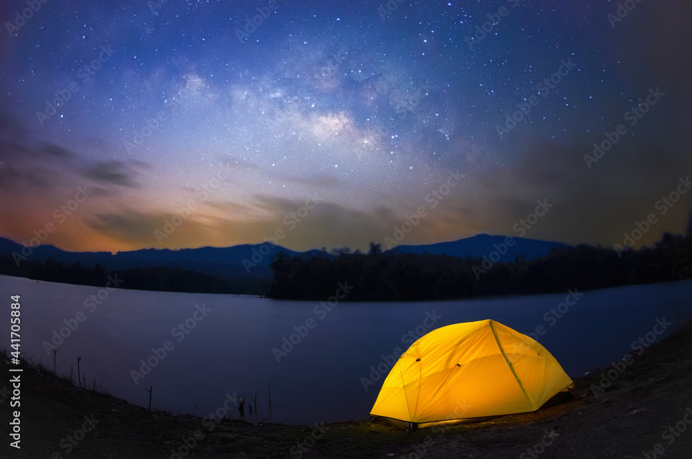 Wall mural Yellow tent under Milky way