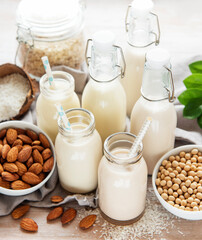 Alternative types of vegan milks in glass bottles