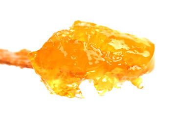naturally crystallized rape honey on white wooden