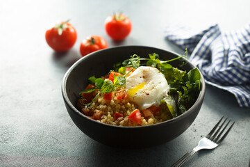 Bulgur with tomato and poached egg
