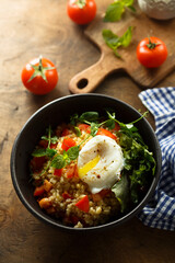 Bulgur with tomato and poached egg