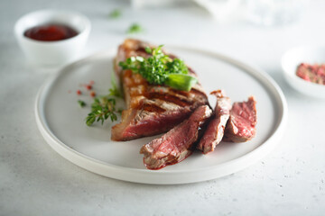 Grilled beef steak with herbs