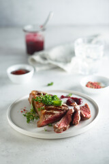 Grilled beef steak with herbs