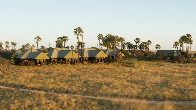 Aerial fly over view of the beautiful tented safari lodge Jack's Camp on the Makgadikgadi Pans, Botswana