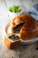 Traditional English meat pie with dried fruits